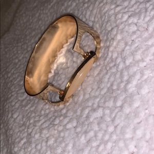 Gold statement bracelet.